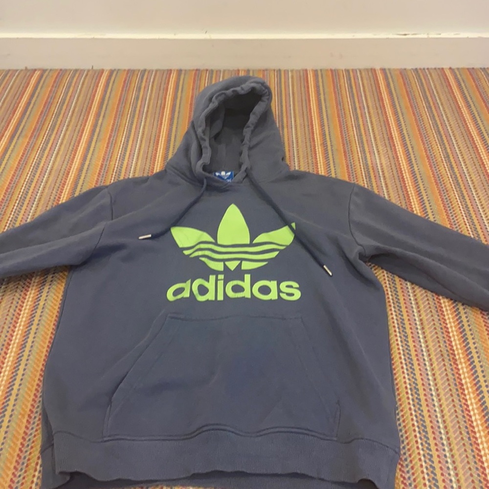 it’s a size medium adidas it’s worn and cool